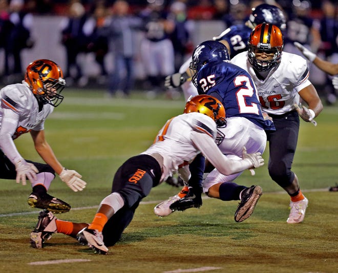 Fitch's Randy Smith is tackled by Massillon's Anthony Ballard while Dillon DeLong (20) and Jamir Thomas (16) close in during last years matchup at Fitch.

(Inde File Photo)