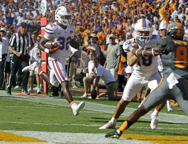 Florida running back Jordan Cronkrite runs for a touchdown during the first half of a college football game against Tennessee Saturday, Sept. 24, 2016, in Knoxville, Tenn. THE ASSOCIATED PRESS / WADE PAYNE
