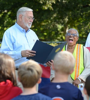 Opal Lee reacts as Fort Smith Mayor Sandy Sanders reads a proclamation naming Thursday, Sept. 22, 2016 as Opal Lee Day during a gathering with students from Montessori and others at Antioch Discovery Garden. Lee made the stop in Fort Smith on her way to Washington, D.C., where she hopes to meet with President Barack Obama. BRIAN D. SANDERFORD/TIMES RECORD