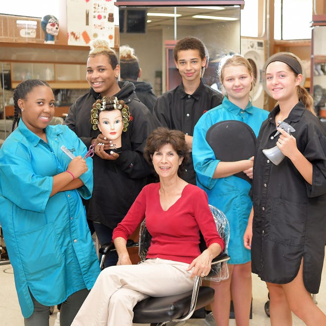 Cosmetology teacher Diane Martin is surrounded by students from left, Tanaysia Hicks, 15, Mark Massey, 15, Tre Cockrum, 16, Lillian Ratcliff, 15, and Shannon Ward, 15.