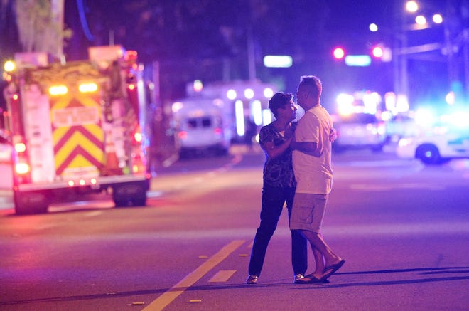 Family members wait for word from police after arriving down the street from the Pulse nightclub in Orlando. Each of the estates of the 49 patrons killed in the massacre will receive $350,000 from donations raised for the victims. Phelan M. Ebenhack/AP file