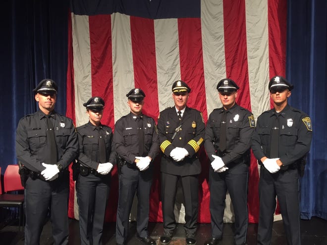 Plymouth Police Chief Michael Botieri poses with the five new local officers who graduated from the Plymouth Police Academy Friday. From left are Aaron Wallace, Katherine Ayers, Shane Harrington, Botieri, David Tassinari and Nicholas Golden.

Courtesy photo