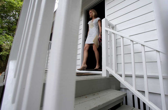 In this Wednesday, April 20, 2016, photo, real estate agent Lauren Newman leaves a home for sale after a client showing in Mount Pleasant, S.C. On Tuesday, Sept. 27, 2016, the Standard & Poor's/Case-Shiller 20-city home price index for July is released. (AP Photo/Chuck Burton)