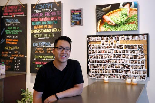In this Friday, Sept. 16, 2016, photo, Mathew Wong poses for portrait at Tea and Milk, a bubble tea shop he co-owns in the Astoria neighborhood in the Queens borough of New York. Wong and his business partners developed a strategy they hope makes their shop stand out and allow it to thrive even if the popularity of bubble tea wanes. (AP Photo/Mary Altaffer)