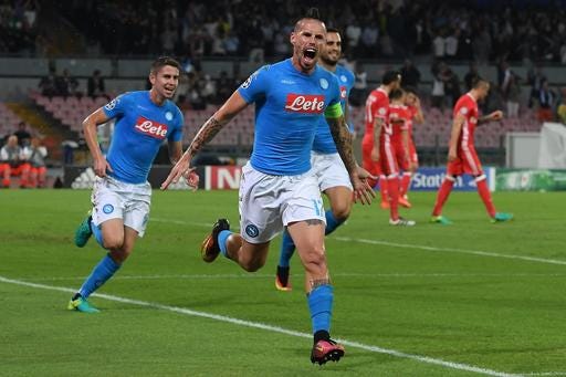 Napoli's Marek Hamsik celebrates after scoring during a Champions League, Group B soccer match between Napoli and Benfica, at the San Paolo stadium in Naples, Italy, Wednesday, Sept. 28, 2016. (Ciro Fusco/ANSA via AP)