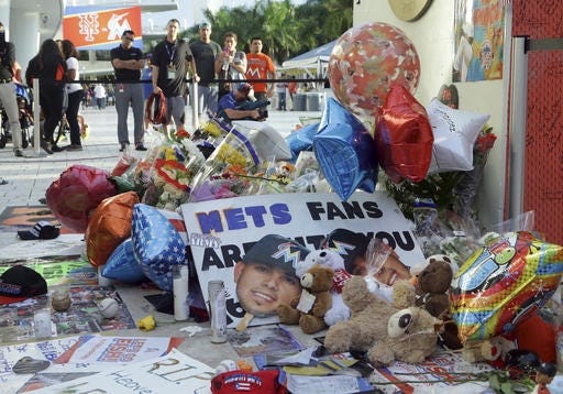 Items sit at a makeshift memorial in memory of Miami Marlins pitcher Jose Fernandez outside of Marlins Park, before a baseball game between the Miami Marlins and the New York Mets, Tuesday, Sept. 27, 2016, in Miami. Fernandez was killed in a boating accident Sunday. THE ASSOCIATED PRESS / LYNNE SLADKY