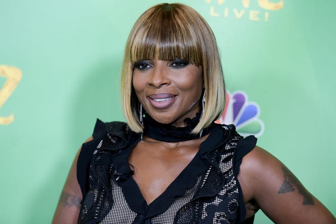 FILE - In this June 1, 2016 file photo, Mary J. Blige attends "The Wiz Live!" Photo Op held at the Directors Guild of America in Los Angeles. A pair of clips teasing Blige's interview with Hillary Clinton on her upcoming Apple Music show "The 411" isn't winning over social media users. The teaser featuring Blige crooning Bruce Springsteen's "American Skin (41 Shots)" before clasping hands with Clinton was mocked online quickly after it was posted Tuesday, Sept. 27 by Apple.(Photo by Richard Shotwell/Invision/AP, File)