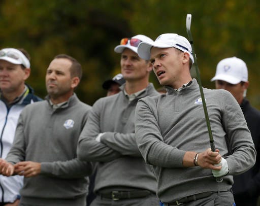 Europe's Danny Willett watches his drive with teammate Europe's Justin Rose and Europe's Sergio Garcia during a practice round for the Ryder Cup golf tournament Wednesday, Sept. 28, 2016, at Hazeltine National Golf Club in Chaska, Minn. (AP Photo/Chris Carlson)