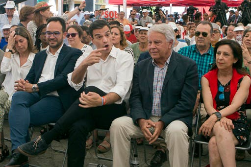 FILE - In this June 24, 2016 file photo, Spanish Socialist leader Pedro Sanchez, center, gestures next to former Spanish Premier Felipe Gonzalez, center right, during a election rally on the last day of campaigning, in Madrid, Spain. Felipe Gonzalez said Wednesday Sept. 28, 2016, that he feels "cheated" by current Socialist party leader Pedro Sanchez for failing to end Spain's nine-month political deadlock. (AP Photo/Paul White, FILE)