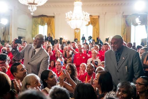 1968 US Olympic athletes Tommie Smith, right, and John Carlos, left, stand as they are recognized by President Barack Obama during a ceremony in the East Room of the White House in Washington, Thursday, Sept. 29, 2016, where the president honored the 2016 United States Summer Olympic and Paralympic Teams. Smith and Carlos extended their gloved hands skyward in racial protest during the playing of "The Star-Spangled Banner" after Smith received the gold and Carlos the bronze medal in the 200 meter run at the Summer Olympic Games in Mexico City 1968. (AP Photo/Andrew Harnik)