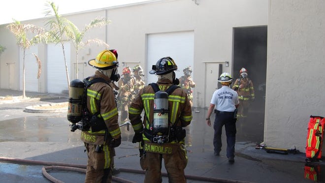 Boca Raton firefighters investigate a fire at a warehouse Thursday morning. (Photo by Boca Raton Fire Rescue)