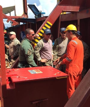 Members of the Lee County Sheriff’s Office waterborne strike team are briefed aboard the container ship 'Queen B' as part of an exercise at Port Manatee. PHOTO / PORT MANATEE