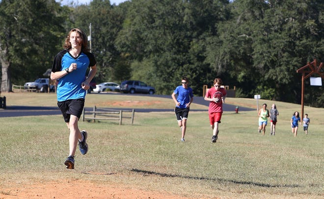 Members of the Capitol School cross country team practice at Munny Sokol Park in Tuscaloosa, Ala. on Thursday, Sept. 29, 2016.  Staff Photo/Erin Nelson