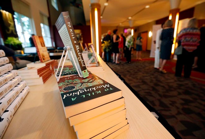 Copies of Harper Lee's "To Kill A Mockingbird" for sale at a University of Alabama SUPe Store table set up at the Alabama Writers Hall of Fame Inaugural Induction Ceremony hosted at the Bryant Conference Center Monday, June 8, 2015. Staff Photo | Michelle Lepianka Carter
