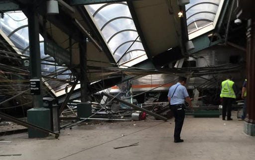 This Thursday, Sept. 29, 2016 photo provided by a passenger who was on the train when it crashed shows wreckage at the Hoboken, N.J. rail station. The commuter train barreled into the station during the morning rush hour, coming to a halt in a covered area between the station's indoor waiting area and the platform.