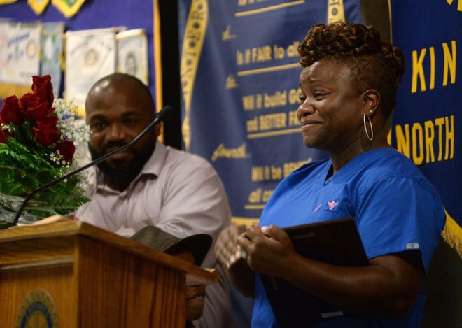 Dr. De Shonta King, of Women’s Healthcare of Eastern Carolina, emotionally accepts the 2016 Minority Business of the Year Award from the Kinston-Lenoir County Chamber of Commerce during Thursday’s Rotary meeting at King’s.