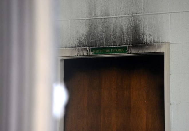 Soot stained walls in the kitchen area of the Kinston High School cafeteria, along with the odor of smoke, serve as evidence of an overnight fire that caused the school to be canceled on Friday.