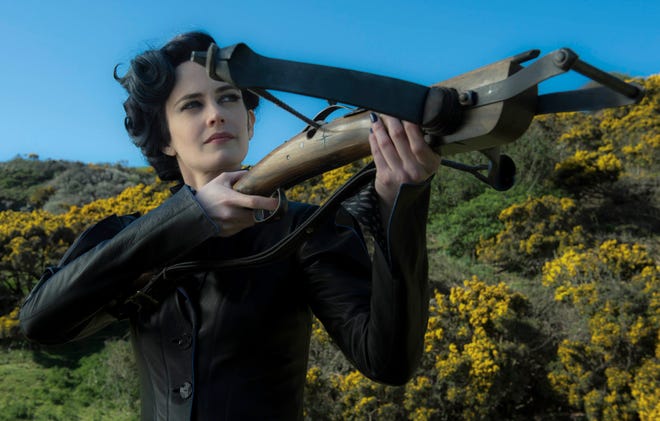 Miss Peregrine (Eva Green) is as good with caring for kids as she is with a crossbows. (20th Century Fox)