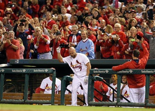 St. Louis Cardinals' Matt Holliday obliges the fans with a curtain call after hitting a solo home run during the seventh inning against the Pittsburgh Pirates in a baseball game Friday, Sept. 30, 2016, at Busch Stadium in St. Louis. (Chris Lee/St. Louis Post-Dispatch via AP)