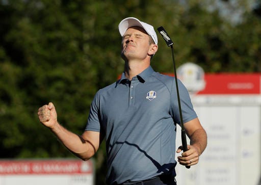 Europe’s Justin Rose reacts after making a birdie on the 14th hole to win the match during a four-balls match at the Ryder Cup golf tournament Friday, Sept. 30, 2016, at Hazeltine National Golf Club in Chaska, Minn. (AP Photo/David J. Phillip)