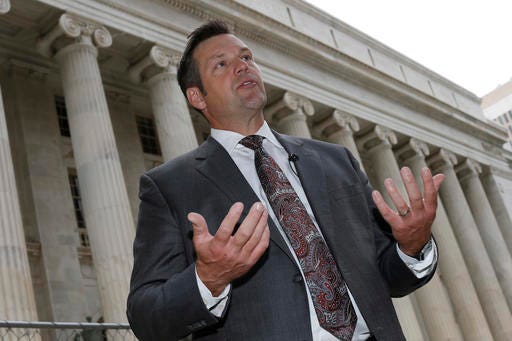 FILE - In this Aug. 23, 2016 file photo, Kansas Secretary of State Kris Kobach responds to questions outside the 10th U.S. Circuit Court of Appeals in Denver. A federal appeals court says "no constitutional doubt arises" that federal law prohibits Kansas from requiring citizenship documents from people who register to vote at motor vehicle offices. The ruling handed down late Friday evening, Sept. 30, 2016, upholds U.S. District Judge Julie Robinson's temporary order forcing Kansas to register more than 20,000 voters. The decision is the latest setback for Kobach. (AP Photo/David Zalubowski, File)