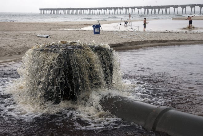 Water wells up out of a concrete culvert near Pier Park in 2013. Several outfall pipes across Panama City Beach produce discolored and unsightly streams of water along the sand, but the water is harmless and nontoxic. NEWS HERALD FILE PHOTO