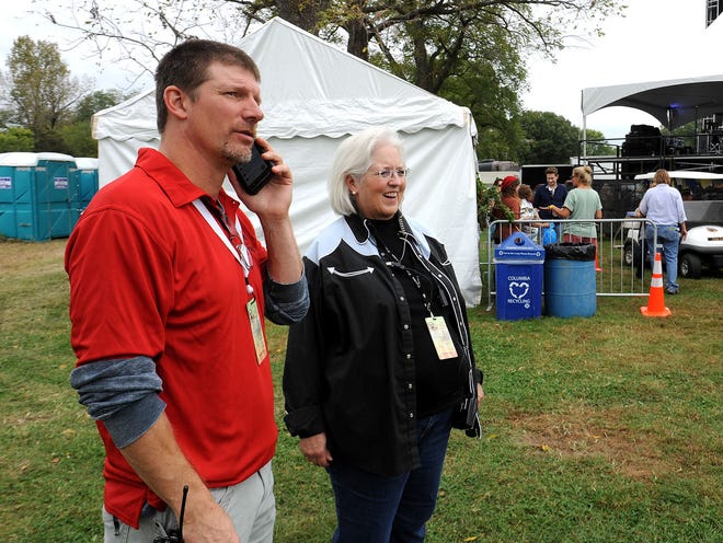 Bill Clinton, left, and Reggie Wilhite have been volunteering as part of security at the Roots N Blues N BBQ festival for the past nine and 10 years, respectively. More than 500 volunteers are helping at this year’s festival, which continues Sunday at Stephens Lake Park.