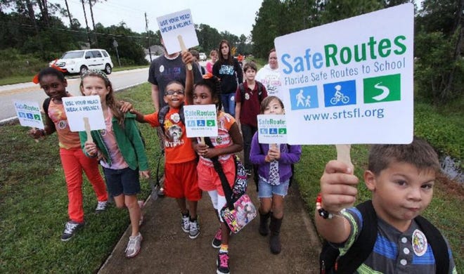 Students at Rymfire Elementary rally for safe routes to schools during a 2013 celebration of National Walk to School Day. News-Journal file/David Tucker