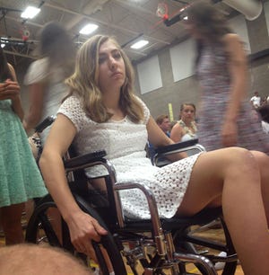 Sam Cook had to use a wheelchair to attend her eight grade graduation. (Family photo)