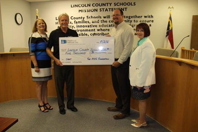 Pictured, from left, Dr. Rhonda Hager, Lincoln County Schools; Michael M. Durham, PNG; Mark Mullen, Lincoln County Board of Education; and Dr. Sherry Hoyle, Lincoln County Schools. Lincoln County Schools photo.