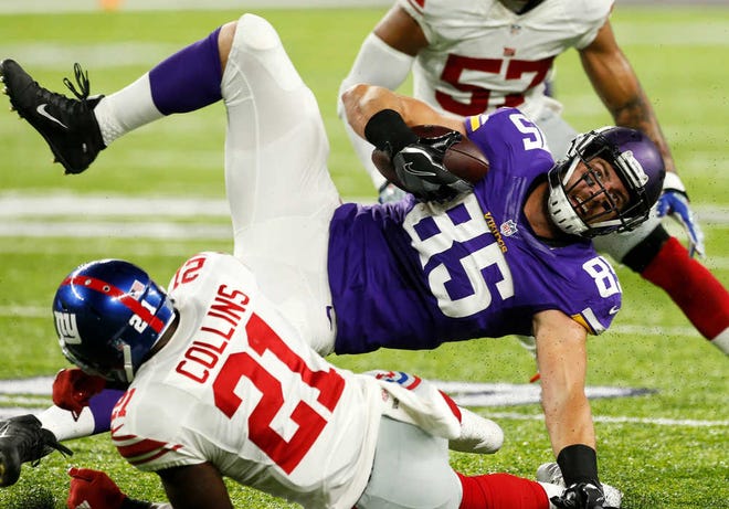 Minnesota tight end Rhett Ellison (85) is upended by New York Giants safety Landon Collins (21) after making a catch on Monday in Minneapolis. The Vikings won, 24-10.