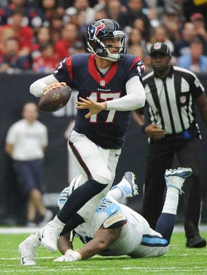 Houston Texans quarterback Brock Osweiler (17) is pressured by Tennessee Titans defensive end Jurrell Casey (99) during the first half of an NFL football game, Sunday, Oct. 2, 2016, in Houston. (AP Photo/George Bridges)