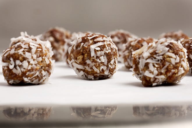 Date-Coconut energy balls offer a portable pop of energy wherever and whenever you need it. DEB LINDSEY / THE WASHINGTON POST