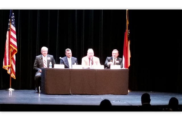 SPEAK OUT — Candidates for the court and district attorney’s office speak at a candidate forum Tuesday at Sunset Theater in Asheboro. They include, from left, District 19B Judge Skipper Creed, Randolph County Assistant District Attorney Andy Gregson, Judge Jimmy Hill and Judge Rob Wilkins. (J.D. Walker / The Courier-Tribune)