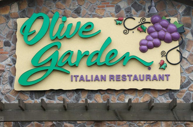This Monday, June 27, 2016, photo shows an Olive Garden restaurant, a Darden brand, in Methuen, Mass. Darden reports financial results Tuesday, Oct. 4, 2016. (AP Photo/Elise Amendola)