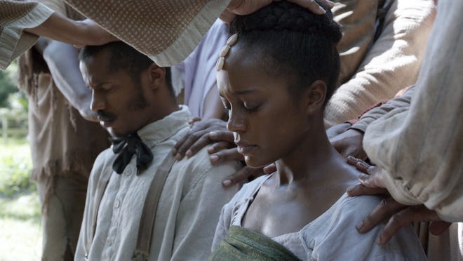 Nate Parker as Nat Turner and Aja Naomi King as Cherry in "The Birth of a Nation."