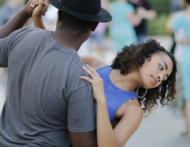 Jayon Henry, left, dips Alex Payne while dancing during tango night for Dancing in the Gardens at the Myriad Botanical Gardens, Friday, August 5, 2016. Photo by Doug Hoke, The Oklahoman Archives
