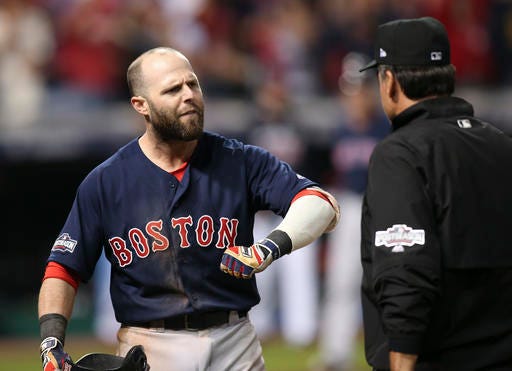 Boston Red Sox's Dustin Pedroia talks about a third strike on a checked swing with first base umpire Phil Cuzzi, during the ninth inning against the Cleveland Indians in Game 1 of baseball's American League Division Series, Thursday, Oct. 6, 2016, in Cleveland. Cleveland won 5-4. (AP Photo/Aaron Josefczyk)