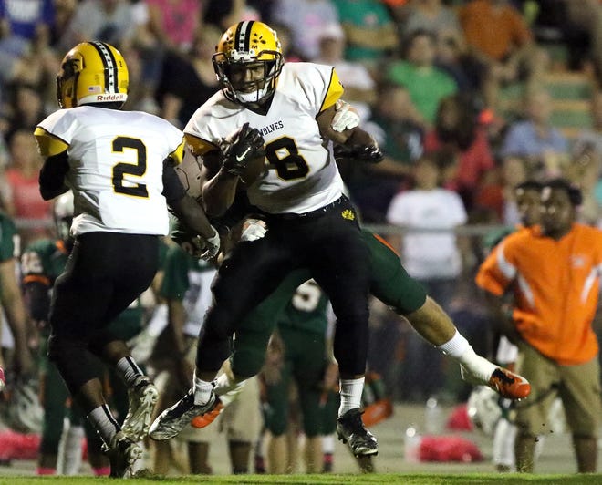 Lincolnton #8 Xavier McClain leaps into the air during a win over East Lincoln on Sept. 30. The Wolves faced Bandys Friday night. PHOTO MIKE HENSDILL/TH EGAZETTE