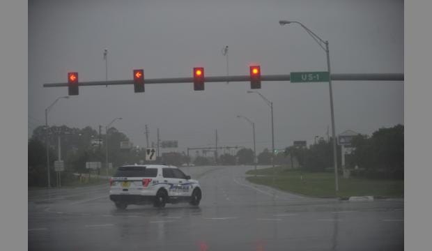 christina.kelso@staugustine.com — A police SUV sits at the intersection of State Road 312 and U.S. 1 as storm conditions from Hurricane Matthew pour onto the mostly vacated roads on Friday October 7, 2016.