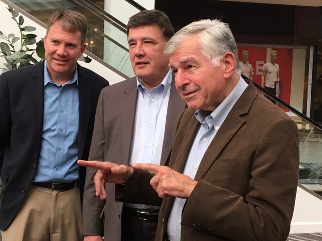 Left to right, Taunton Mayor Thomas Hoye; state Sen. Marc Pacheco, D-Taunton; and former Massachusetts Gov. Mike Dukakis talk Friday at a South Coast Rail forum in Taunton, where all three supported a commuter rail through Stoughton, rather than the Middleboro alternative that emerged over the summer. 

MIKE LAWRENCE / THE STANDARD-TIMES / SCMG