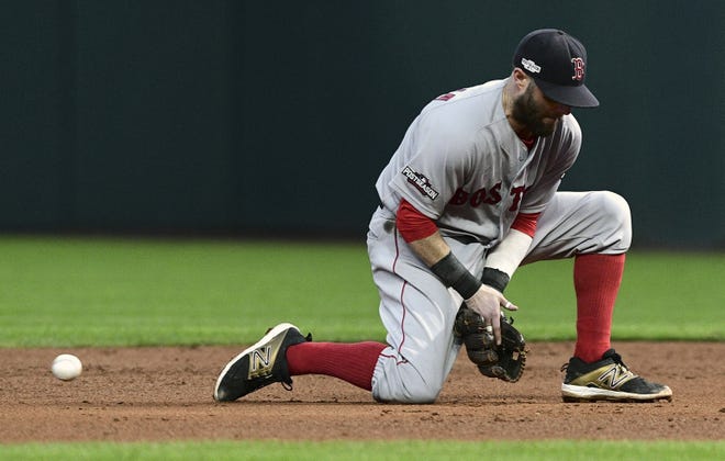 A ground ball by Cleveland's Roberto Perez scoots past Red Sox second baseman Dustin Pedroia in the sixth inning of Friday's playoff game in Cleveland. DAVID DERMER/THE ASSOCIATED PRESS