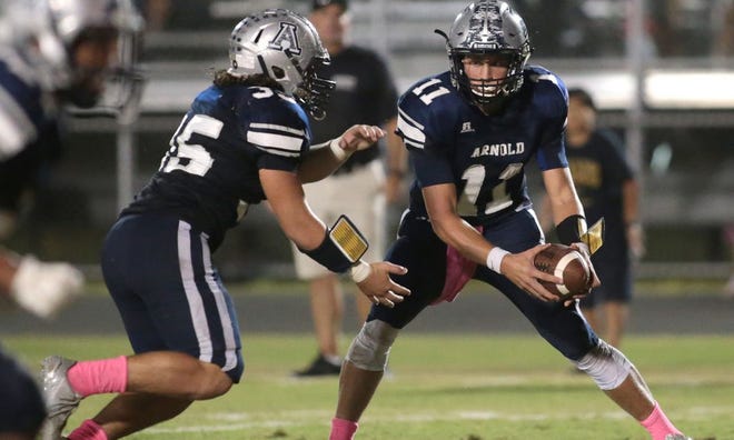 Arnold quarterback Cade Ledman (11) threw for 149 yards and three touchdown passes.