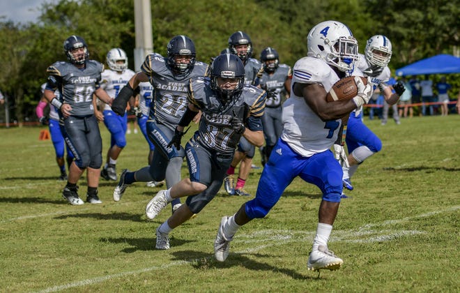 Mount Dora Christian Academy's Jasper Pierre (4) runs for a touchdown against First Academy of Leesburg on Saturday at Sleepy Hollow Recreation Complex. Pierre ran for 164 yards against the Eagles in a little more than a half as MDCA won 34-6. (Paul Ryan / Correspondent)