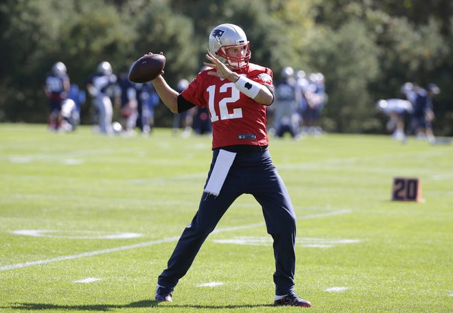 New England quarterback Tom Brady rejoined his team for practice this week. AP Photo/Steven Senne
