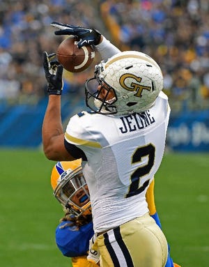 Georgia Tech wide receiver Ricky Jeune (2) catches a touchdown pass over Pittsburgh defensive back Ryan Lewis (38) during the first half of an NCAA football game in Pittsburgh, Saturday, Oct. 8, 2016. (AP Photo/Fred Vuich)