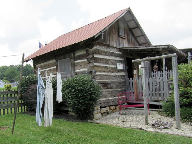 A one-room cabin once home to a family of eight stands in BitterSweet Cabin Village in Renfro Valley, Ky.