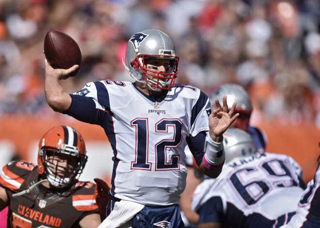 New England Patriots quarterback Tom Brady passes against the Cleveland Browns in the first half of a game Sunday in Cleveland. (AP Photo/David Richard)