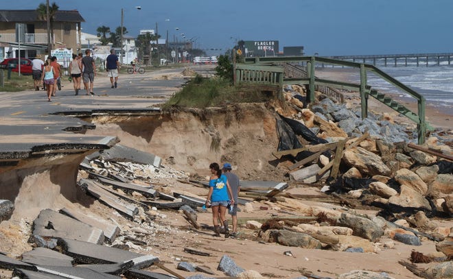 People check out the stretch of State Road A1A that was destroyed by Hurricane Matthew in Flagler Beach on Sunday, October 9, 2016. News-Journal/JIM TILLER