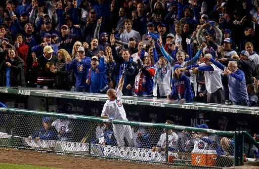Chicago Cubs' Travis Wood (37) celebrates after a home run in the fourth inning of Game 2 of baseball's National League Division Series against the San Francisco Giants, Saturday, Oct. 8, 2016, in Chicago. (AP Photo/Charles Rex Arbogast)